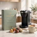Velora coffee pods box with pods and a single-serve brewer